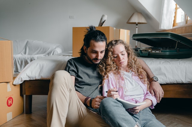 couple sitting on ground